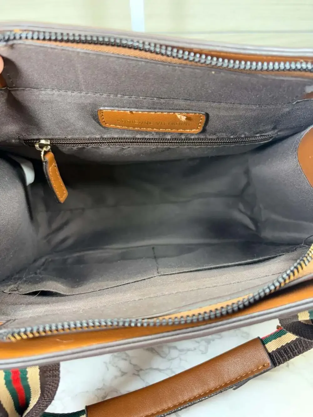 Adrienne Vittadini brown satchel handbag featuring an 